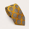 A rolled George Neale gold and blue patterned silk tie.