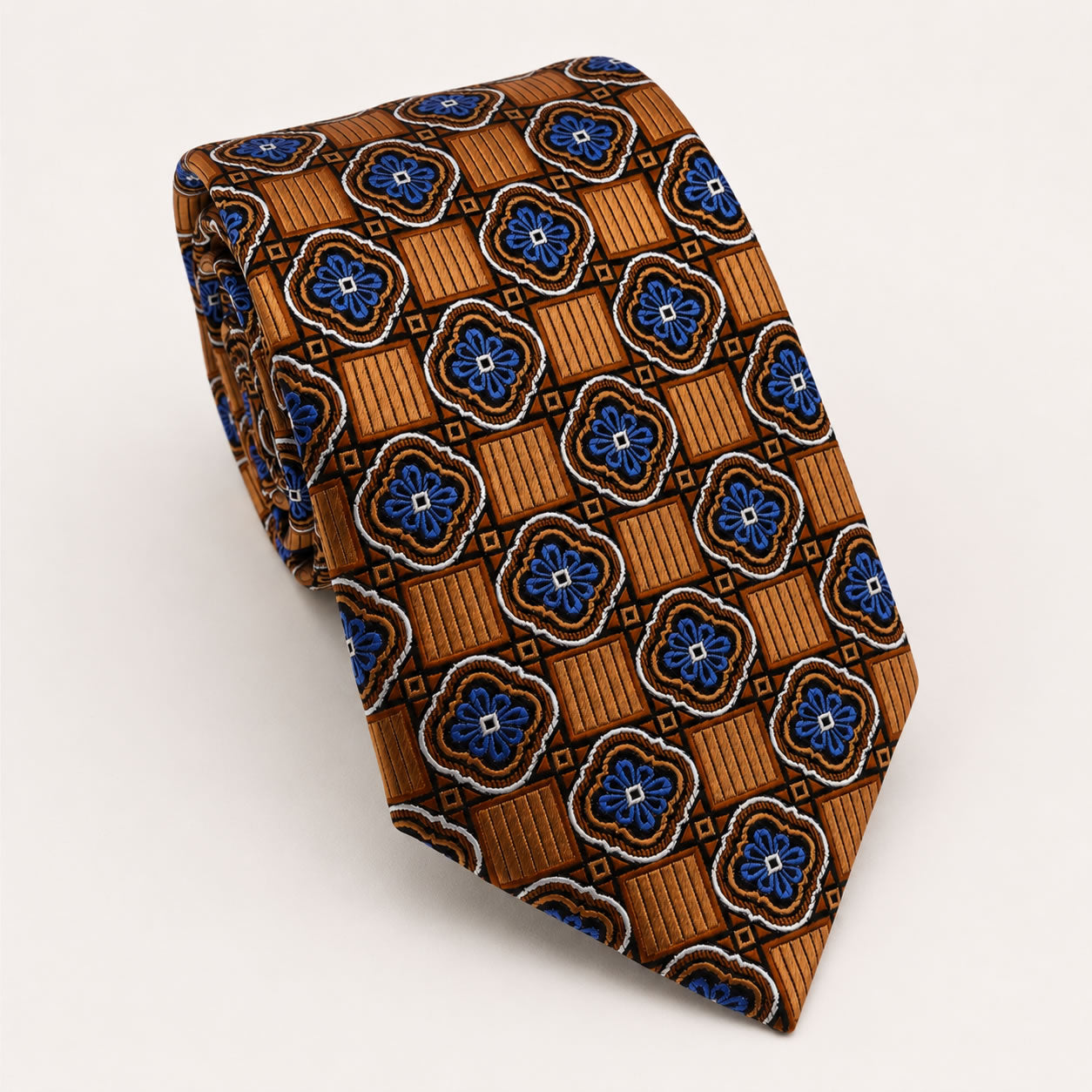 A rolled George Neale copper and blue patterned silk tie.