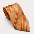 A rolled George Neale orange and gold patterned silk tie.