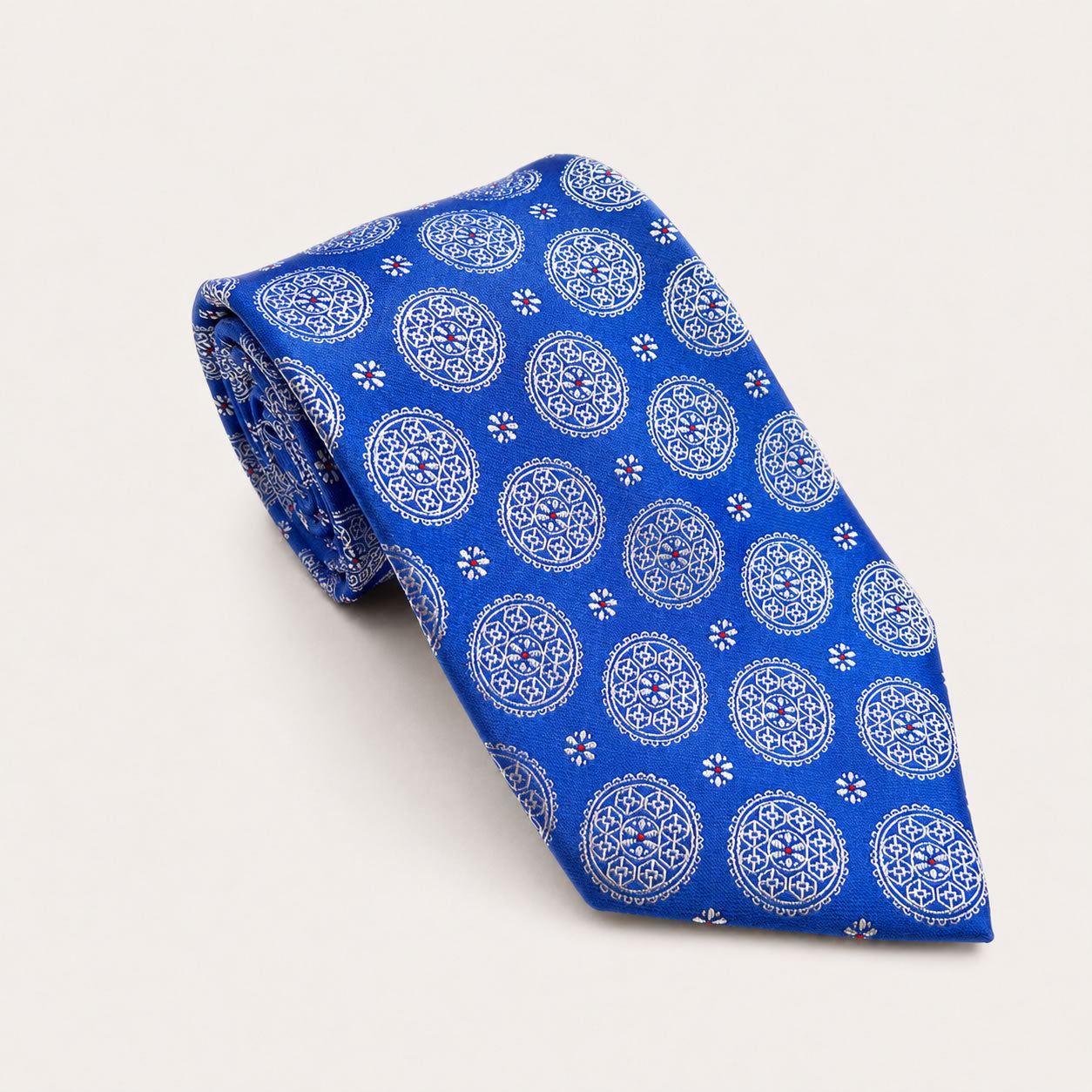 A rolled George Neale royal blue patterned silk tie.