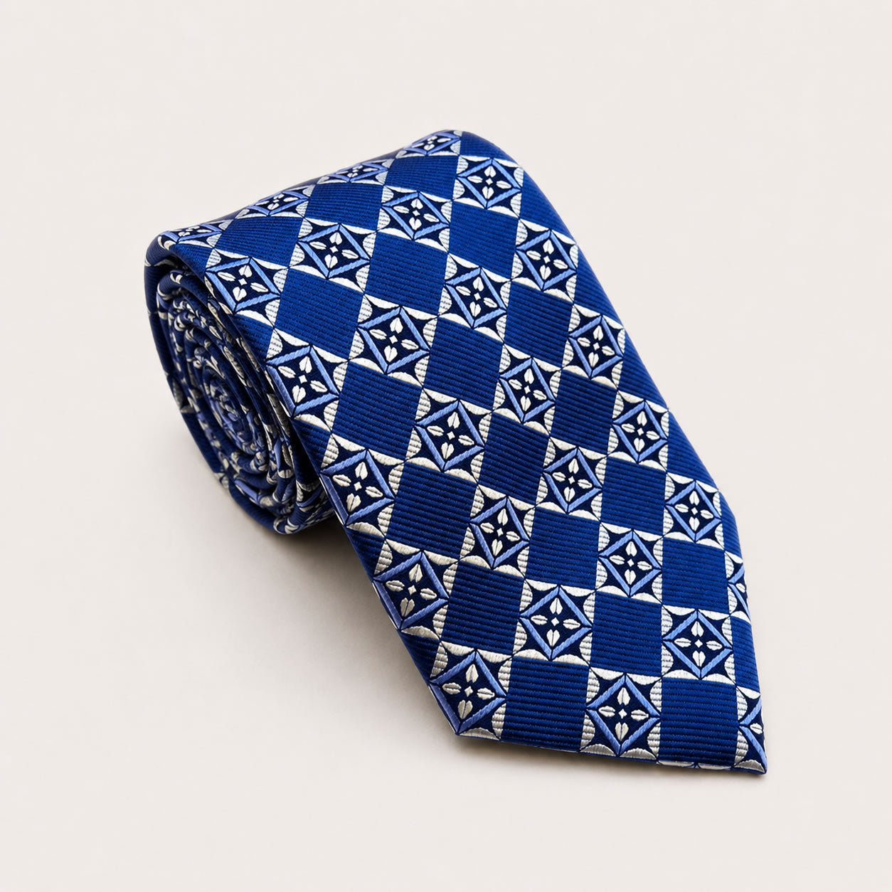 A rolled George Neale navy patterned silk tie.
