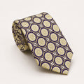 A rolled George Neale purple and champagne patterned silk tie.