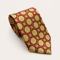 A rolled George Neale red and champagne patterned silk tie.