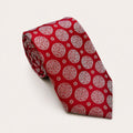 A rolled George Neale red patterned silk tie.