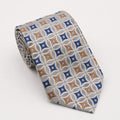 A rolled George Neale silver and blue patterned silk tie.