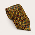 A rolled George Neale brown and gold patterned silk tie.