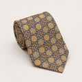 A rolled George Neale navy and gold patterned silk tie.