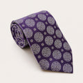 A rolled George Neale purple patterned silk tie.