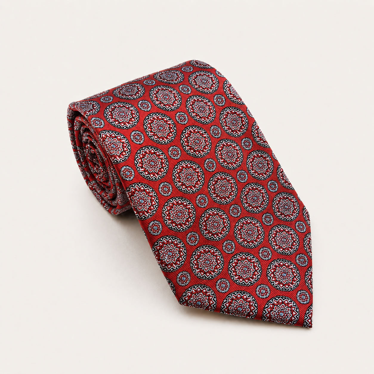 A rolled George Neale red patterned silk tie.