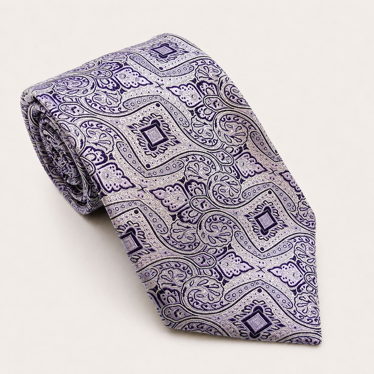 A rolled George Neale lilac patterned silk tie.