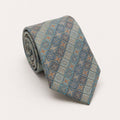 A rolled George Neale silver and blue patterned silk tie.