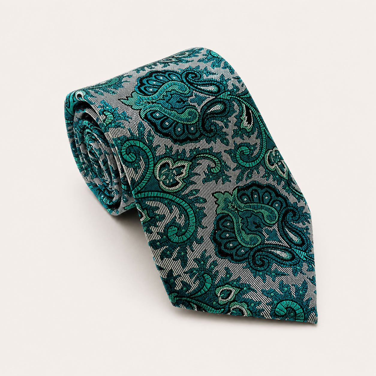 A rolled George Neale teal and silver patterned silk tie.