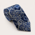 A rolled George Neale silver and navy patterned silk tie.