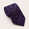 A rolled George Neale purple and black patterned silk tie.