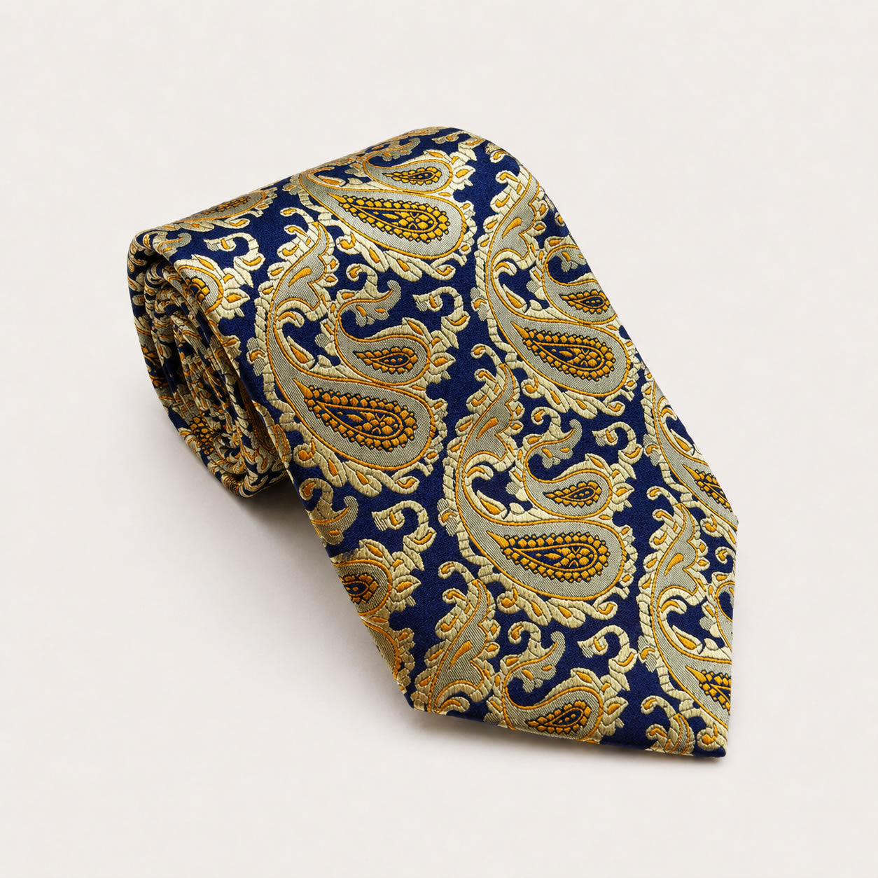 A rolled George Neale navy and gold paisley silk tie.