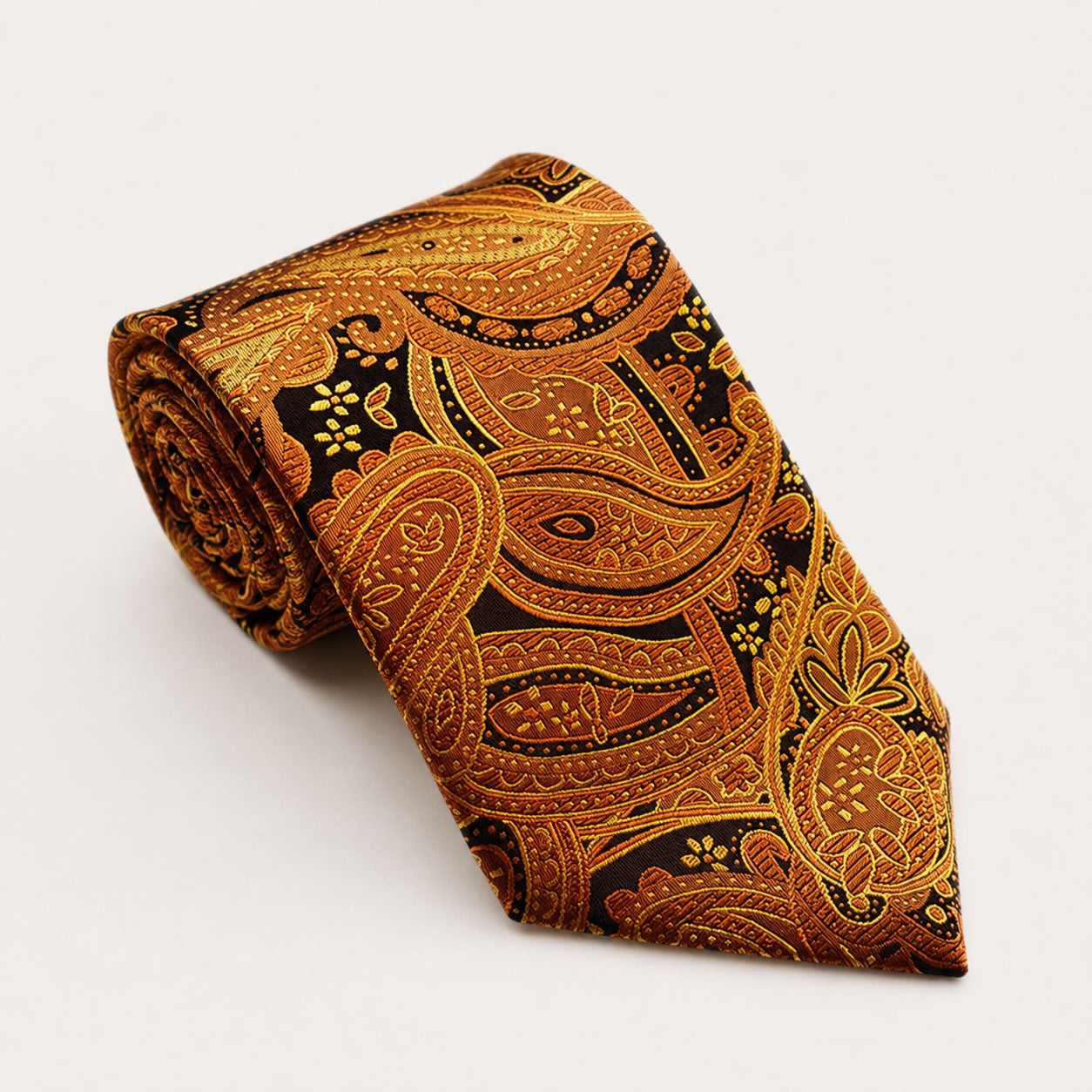 A rolled George Neale bronze and black paisley silk tie.