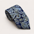 A rolled George Neale navy and light blue paisley silk tie.