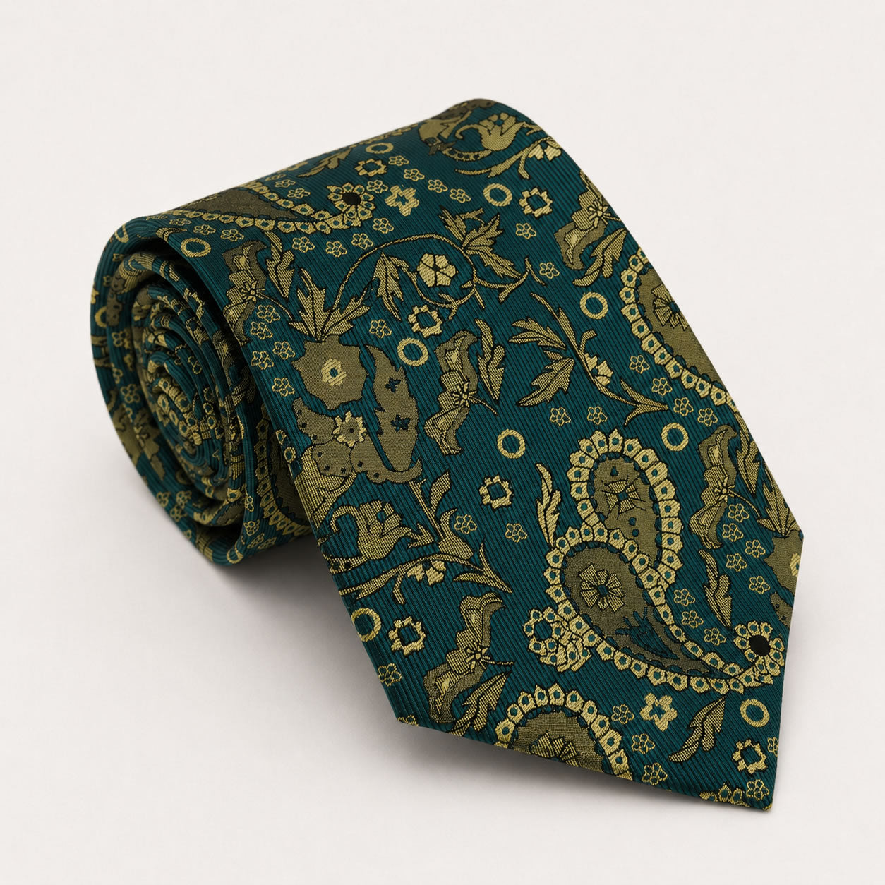 A rolled George Neale teal and gold paisley silk tie.