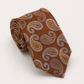 A rolled George Neale burnt orange and light blue paisley silk tie.