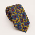 A rolled George Neale yellow and blue paisley silk tie.