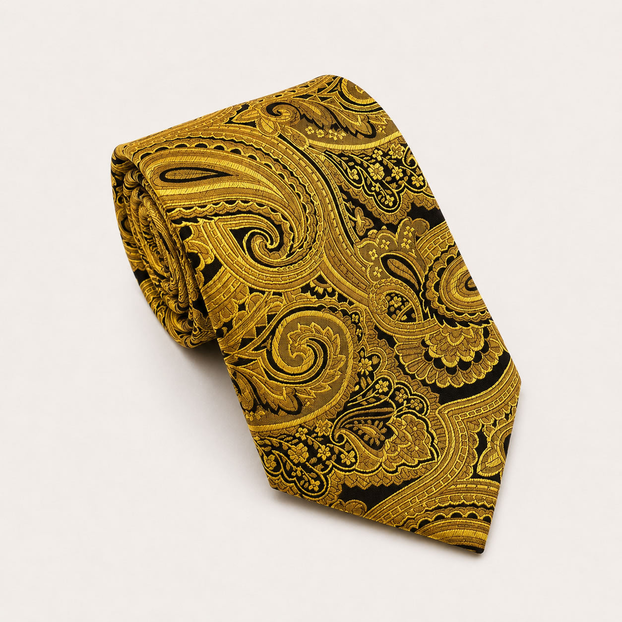 A rolled George Neale gold and black paisley silk tie.