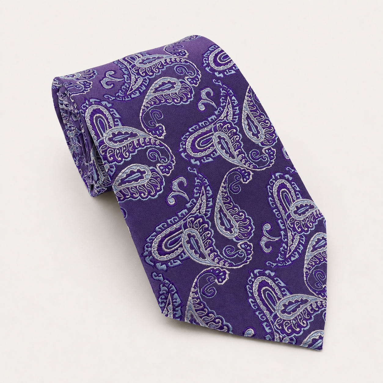 A rolled George Neale purple and silver paisley silk tie.