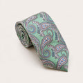 A rolled George Neale mint green and silver paisley silk tie.