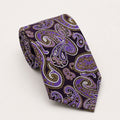 A rolled George Neale purple and gold paisley silk tie.