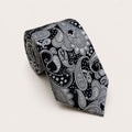 A rolled George Neale black and silver paisley silk tie.