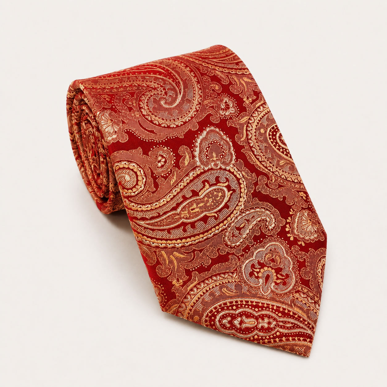 A rolled George Neale red and champagne paisley silk tie.