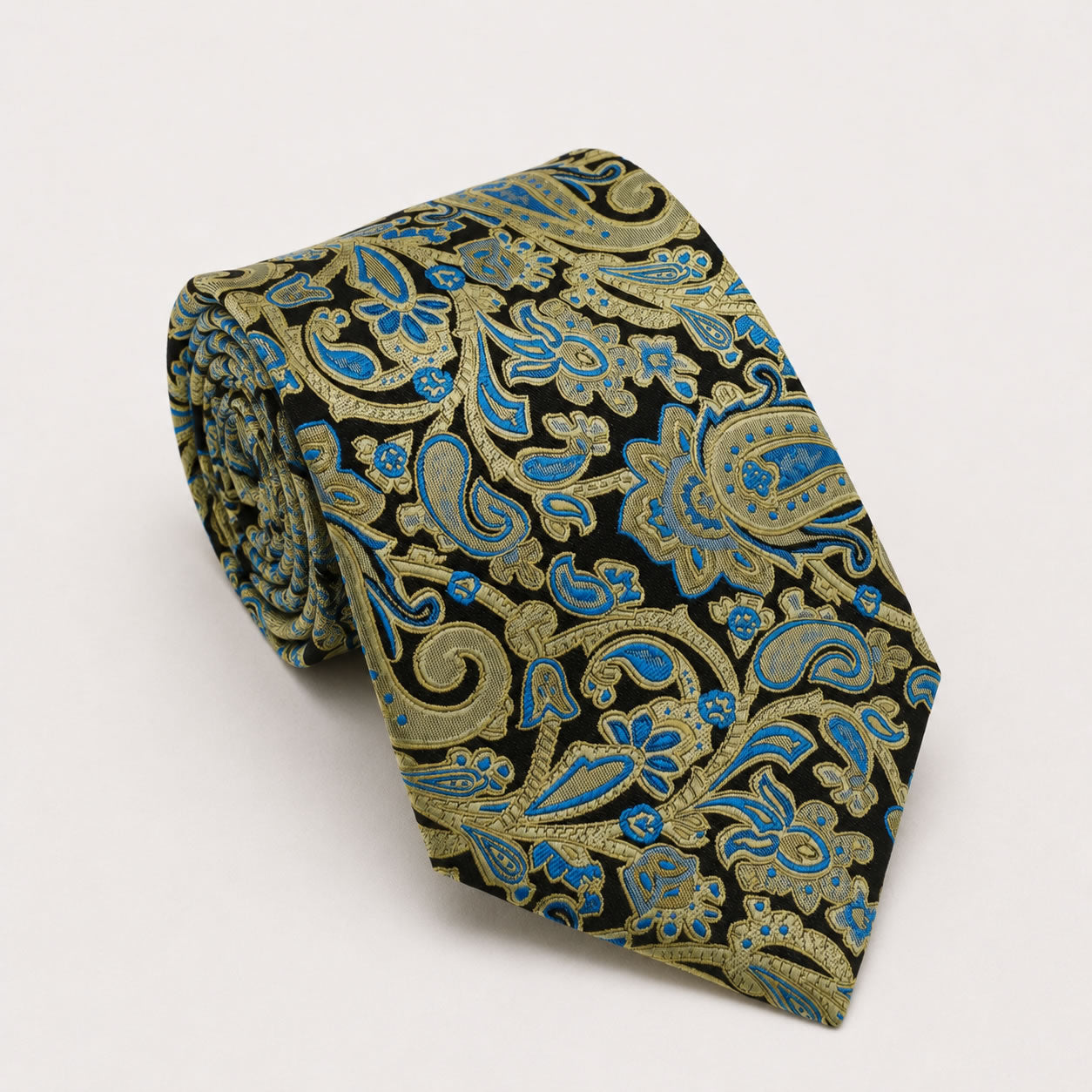 A rolled George Neale black and blue paisley silk tie.