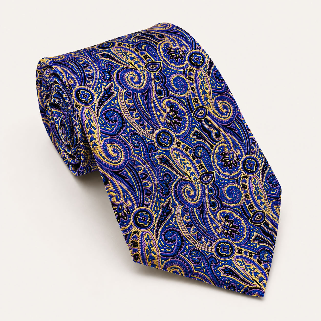A rolled George Neale royal blue and gold paisley silk tie.