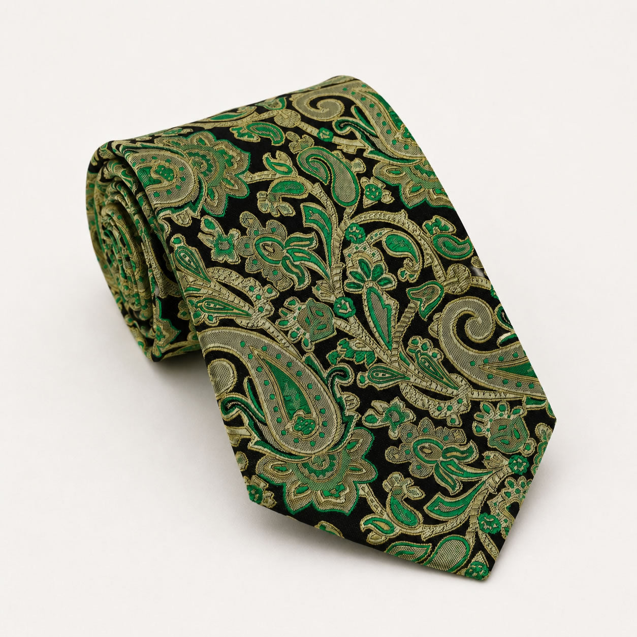 A rolled George Neale black and green paisley silk tie.