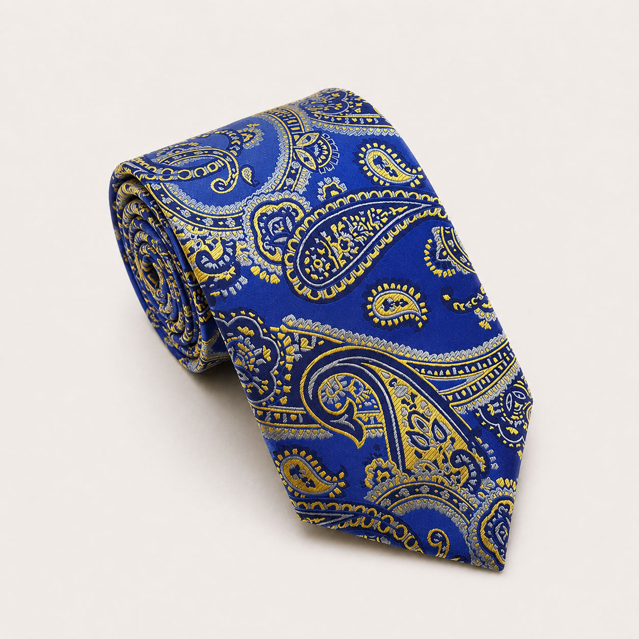 A rolled George Neale royal blue and gold paisley silk tie.
