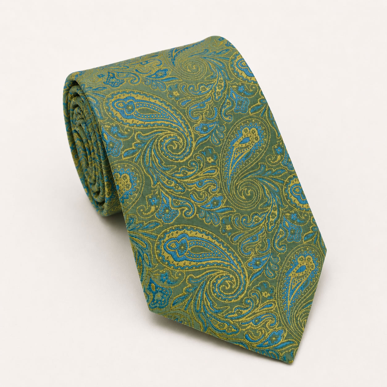 A rolled George Neale olive green and light blue paisley silk tie.