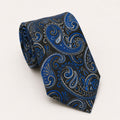A rolled George Neale dark grey and blue paisley silk tie.