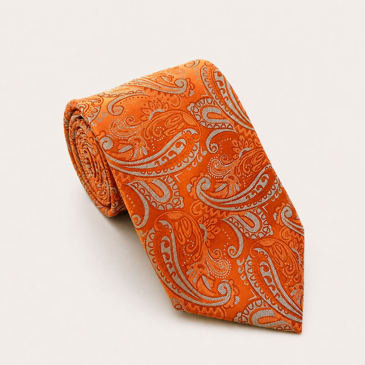 A rolled George Neale orange paisley silk tie.