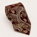 A rolled George Neale burgundy and gold paisley silk tie.