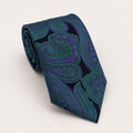 A rolled George Neale dark blue and green paisley silk tie.
