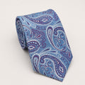 A rolled George Neale light blue and purple paisley silk tie.