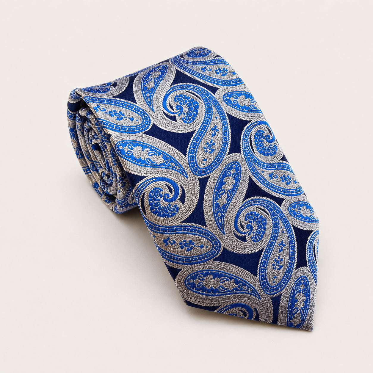 A rolled George Neale navy and silver paisley silk tie.