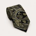 A rolled George Neale black and gold paisley silk tie.
