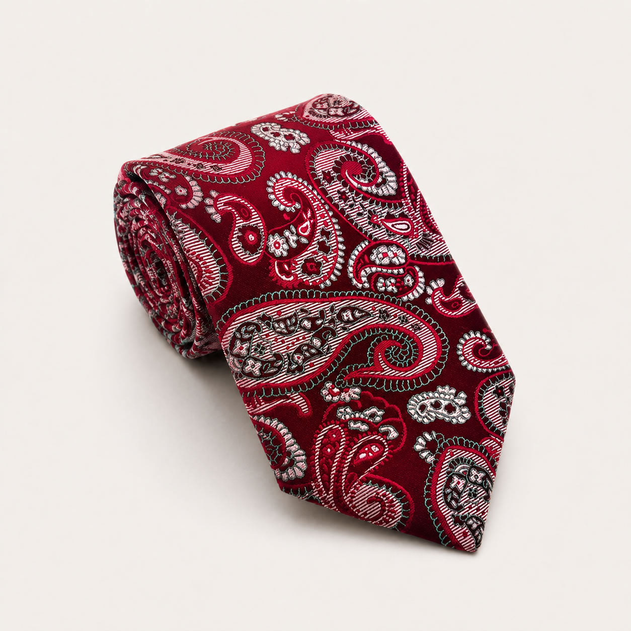 A rolled George Neale burgundy paisley silk tie.