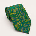 A rolled George Neale green and yellow paisley silk tie.