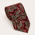 A rolled George Neale red and green paisley silk tie.
