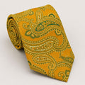 A rolled George Neale gold and green paisley silk tie.