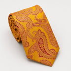 A rolled George Neale gold and red paisley silk tie.