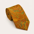 A rolled George Neale green and gold paisley silk tie.