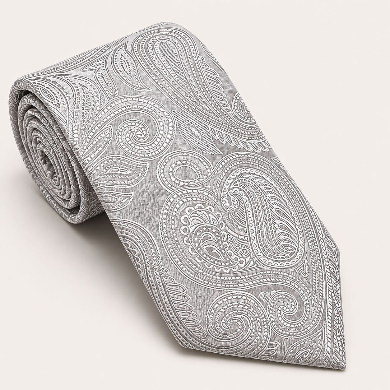 A rolled George Neale silver paisley silk tie.