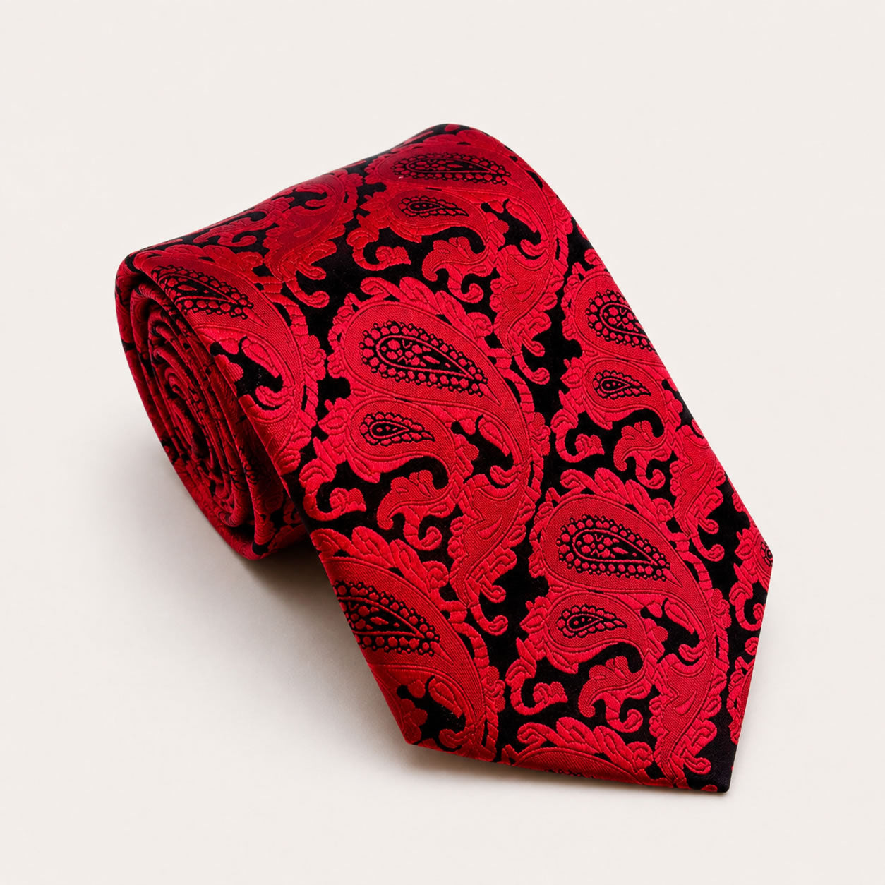 A rolled George Neale red paisley silk tie.
